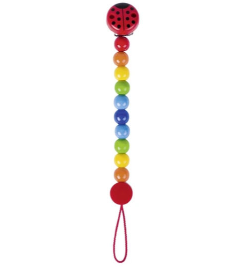 Colorful pacifier clip with a ladybug design on a white background