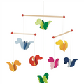 Colorful animal-themed mobile with hanging figures on a white background