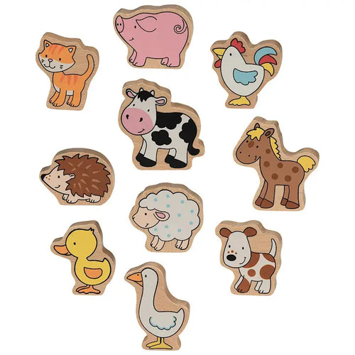 Set of wooden farm animal toys on a white background