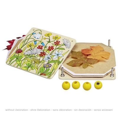 Wooden puzzle with floral design and additional wooden pieces on a white background