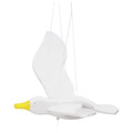 White swan-shaped lamp with a yellow beak on a white background