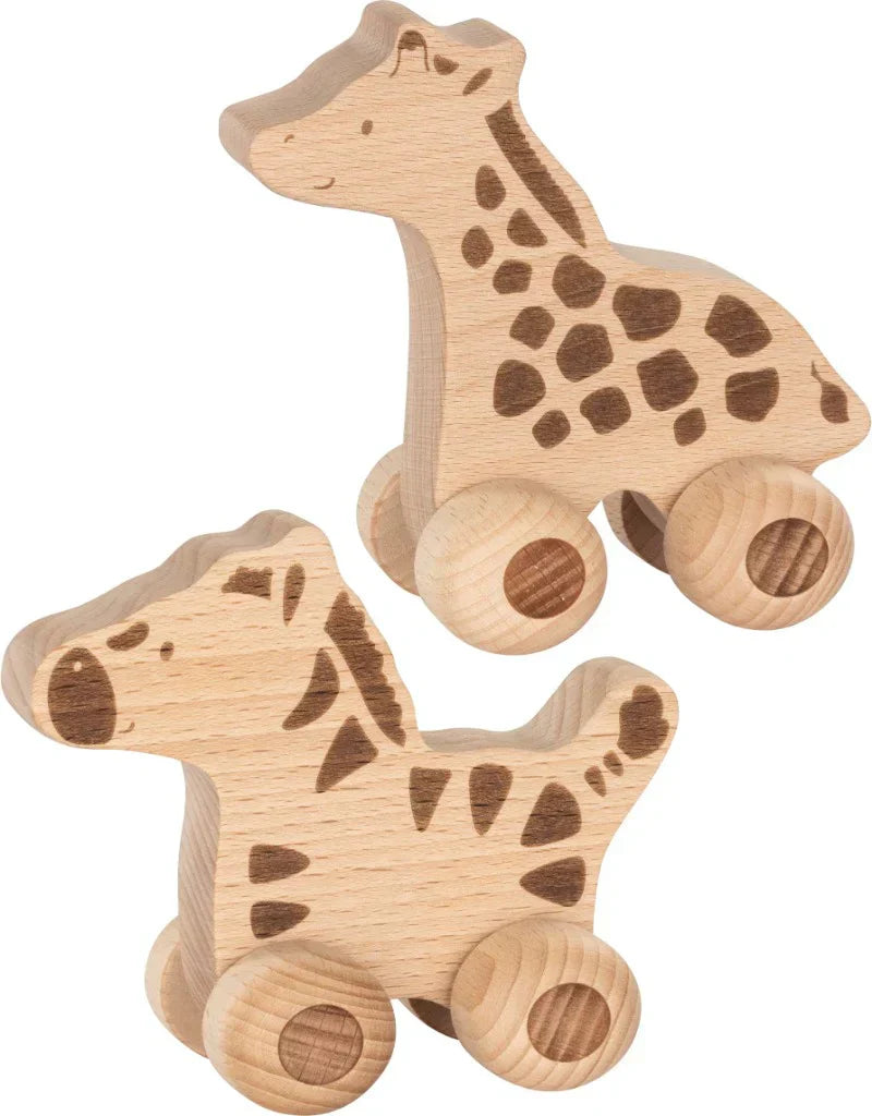 Two wooden giraffe & zebra toys on wheels against a white background