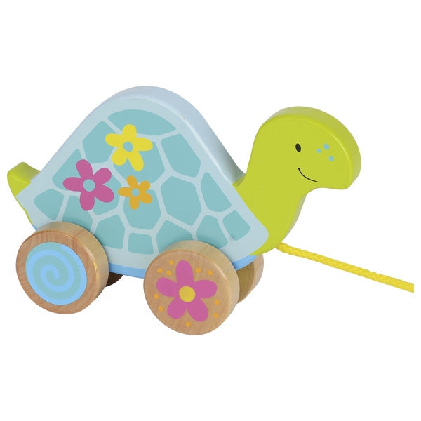 Toy turtle with floral design on a white background
