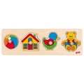 Wooden puzzle with colorful shapes including a house, bird, and bear, on a white background.