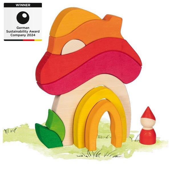 Colorful wooden toy house with a gnome on a white background, featuring the German Sustainability Award 2024.