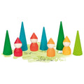 Colorful wooden gnomes and trees on a white background