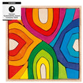 Colorful wooden puzzle with abstract design and German Sustainability Award 2024 badge.