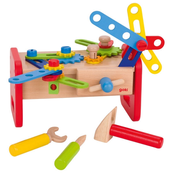 Colorful toy workshop set with tools on a white background