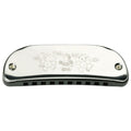 Metallic harmonica with engraved design on a white background