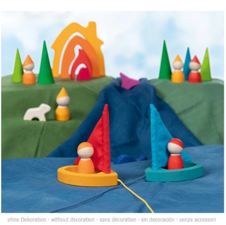 Colorful toy set with figures and landscape on a blue background