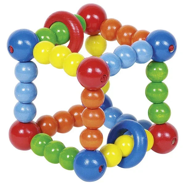 Colorful beaded toy with a heart shape on a white background