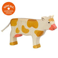 Stuffed cow toy with brown spots on a white background