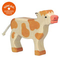 Wooden cow toy on a white background