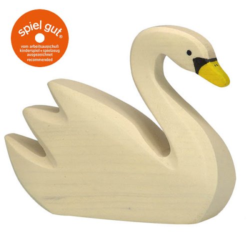White swan figurine on a white background