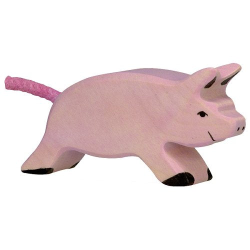 Pink pig figurine on a white background