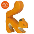 Wooden squirrel figurine on a white background