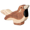 Wooden bird figurine with a natural wood finish on a white background