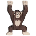 Wooden monkey toy hanging from branches on a white background