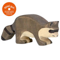 Wooden raccoon figurine on a white background