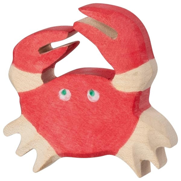 Red crab toy with green eyes on a white background