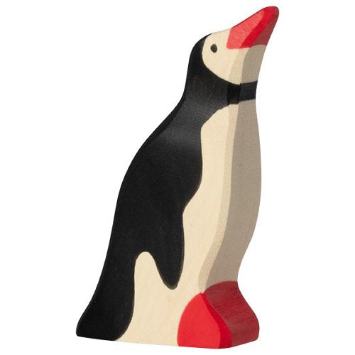 Wooden penguin figurine with a red beak and feet on a white background