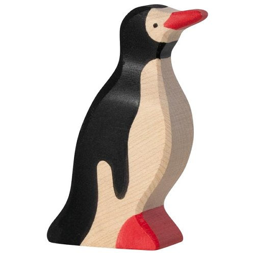 Wooden penguin toy figure on a white background