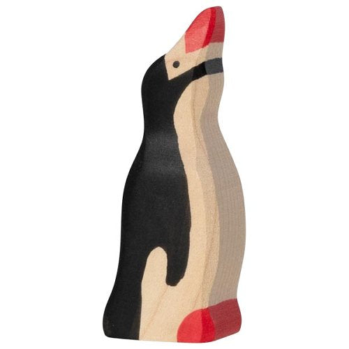 Wooden penguin toy on a white background