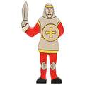 Toy figure of a knight holding a sword on a white background