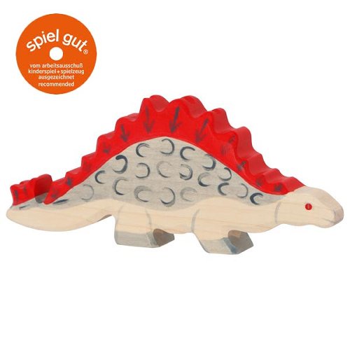 Toy dinosaur with red spikes on a white background