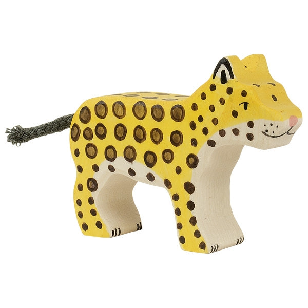 Wooden toy leopard with yellow body and brown spots on a white background