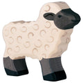 Wooden sheep toy with black face and legs on a white background