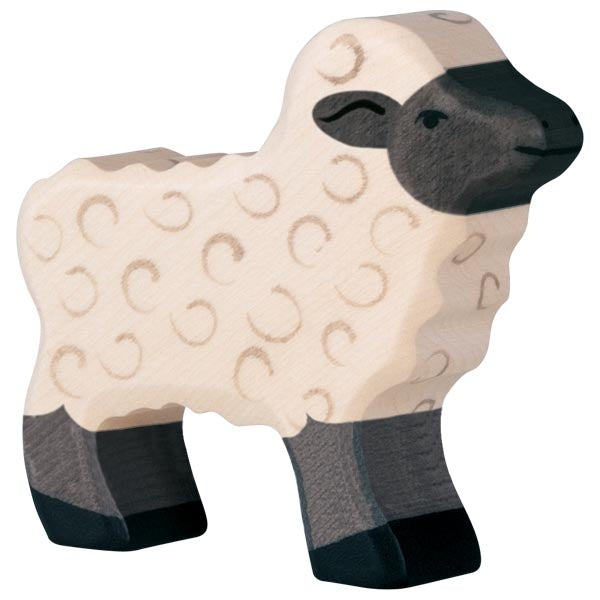 Wooden sheep toy with black face and legs on a white background