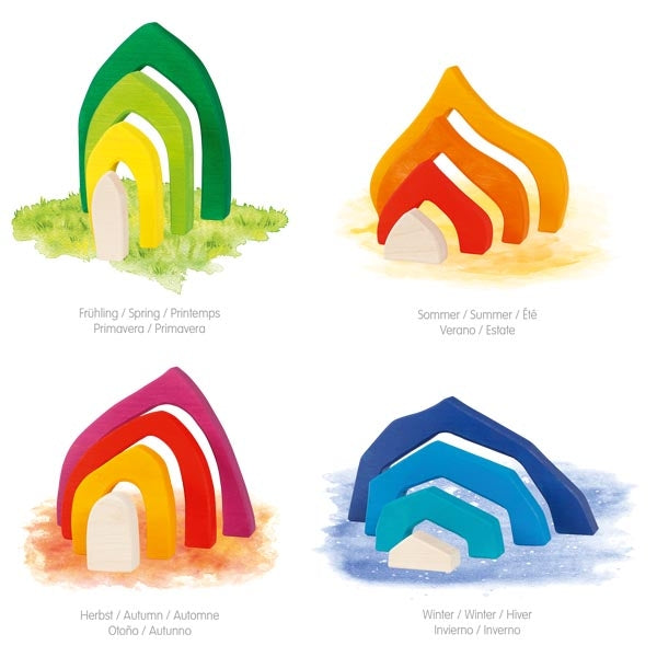 Set of four colorful wooden rainbow-shaped houses with labels for each season on a white background.