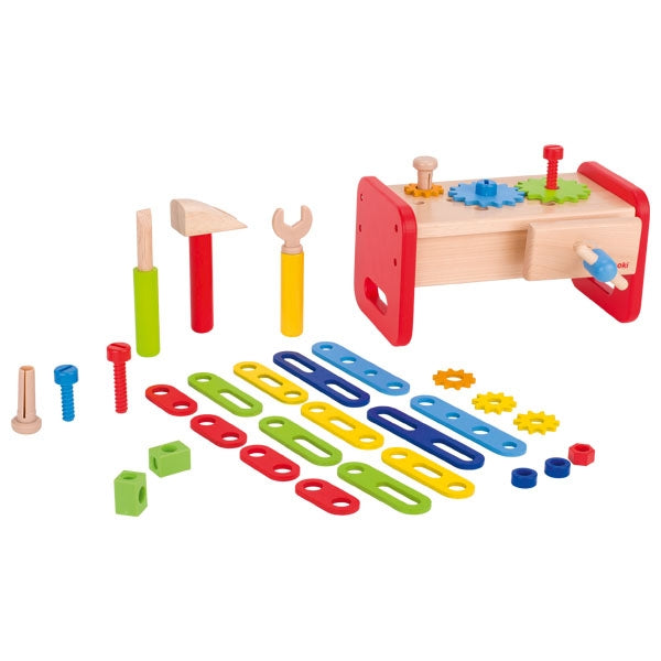Colorful toy tool set with tools and components on a white background