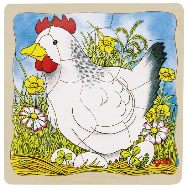 Colorful illustration of a chicken with flowers and grass on a wooden board