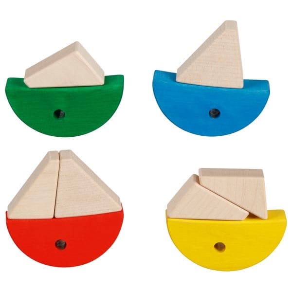 Four colorful wooden sailboats on a white background